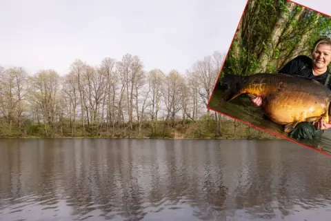 Kobieta trzyma ogromnego karpia, który może być rekord świata karp 100 kg.